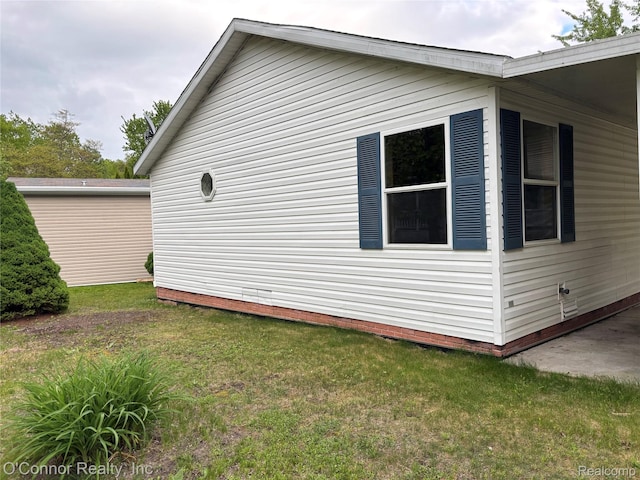 504 Bush Lake Ln, Smiths Creek, MI 48074 - view of property exterior featuring a lawn and crawl space