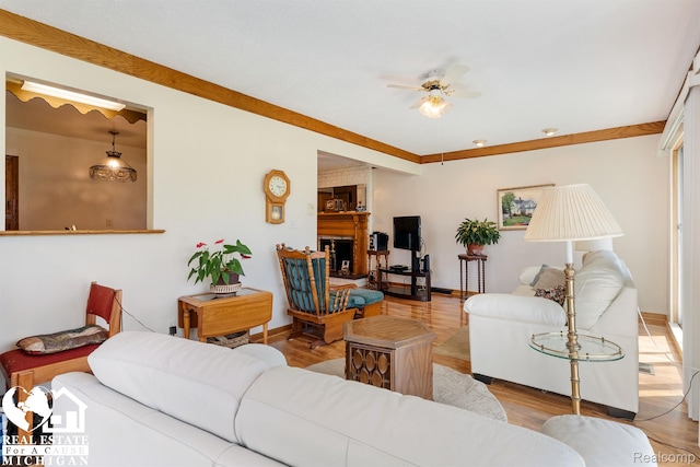 15179 Norman St, Livonia, MI 48154 - living room featuring a ceiling fan, baseboards, and wood finished floors