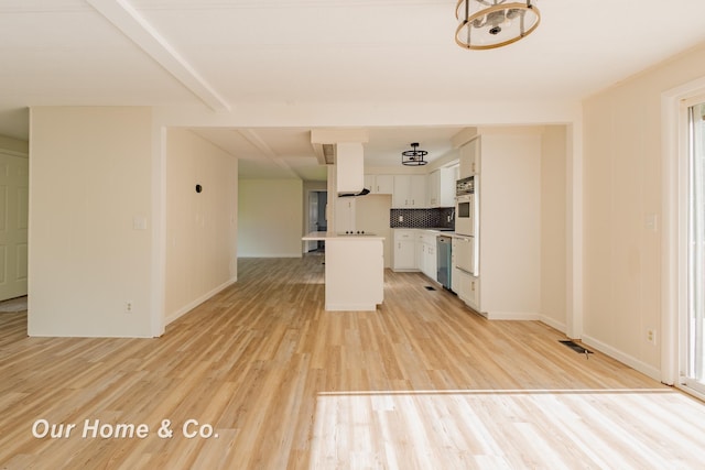 838 S Grey Rd, Midland, MI 48640 - unfurnished living room with light wood-type flooring and baseboards