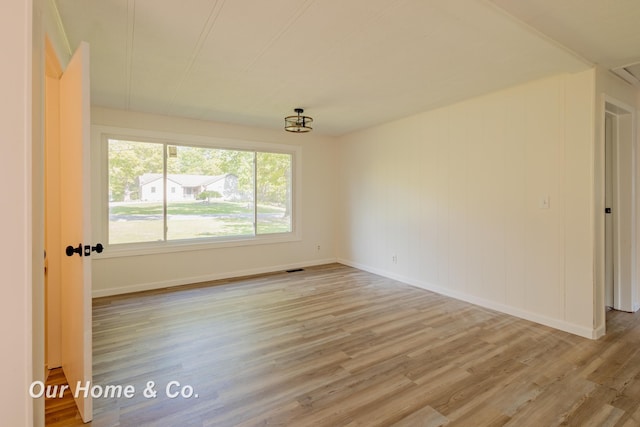 838 S Grey Rd, Midland, MI 48640 - spare room featuring light wood-style flooring and baseboards
