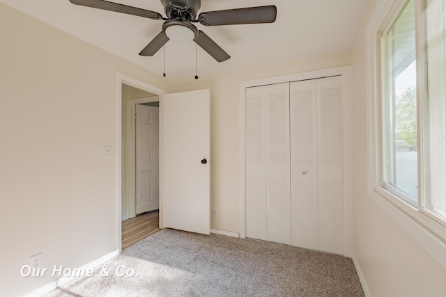 838 S Grey Rd, Midland, MI 48640 - unfurnished bedroom featuring light colored carpet, a closet, ceiling fan, and baseboards