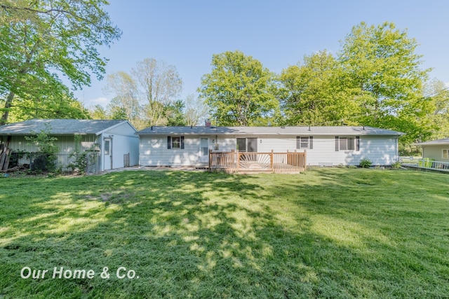 838 S Grey Rd, Midland, MI 48640 - back of property with a lawn and a wooden deck