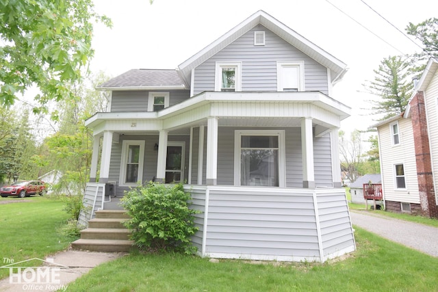231 W Ridge St, Owosso, MI 48867 - view of front of home featuring a porch and a front yard