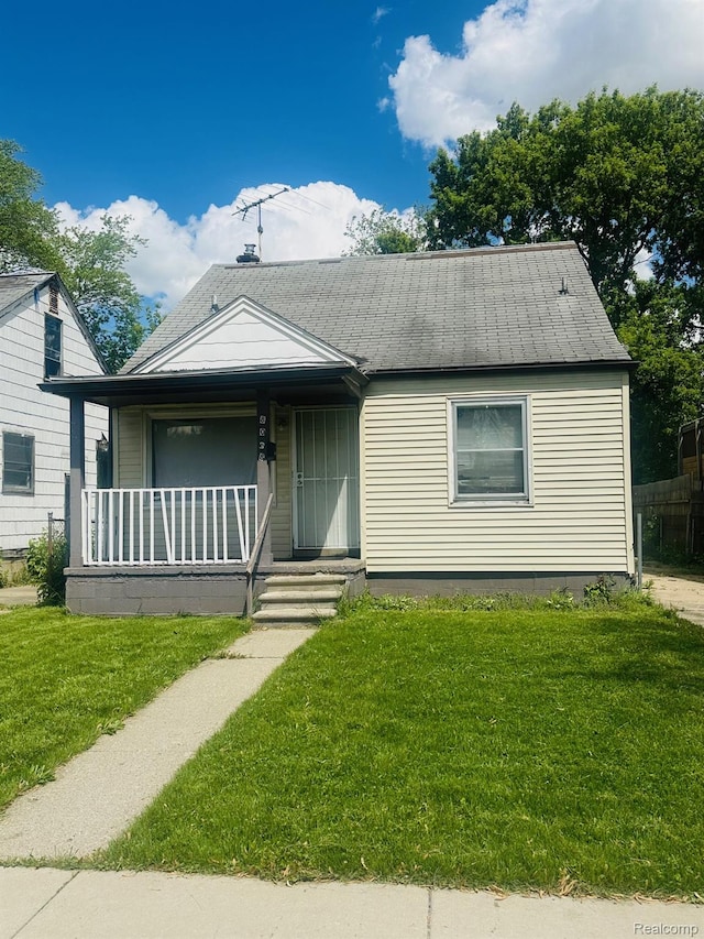 8068 Stahelin Ave, Detroit, MI 48228 - view of front of house with a porch and a front lawn