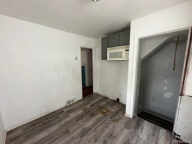 8068 Stahelin Ave, Detroit, MI 48228 - unfurnished bedroom featuring dark wood-type flooring and a closet