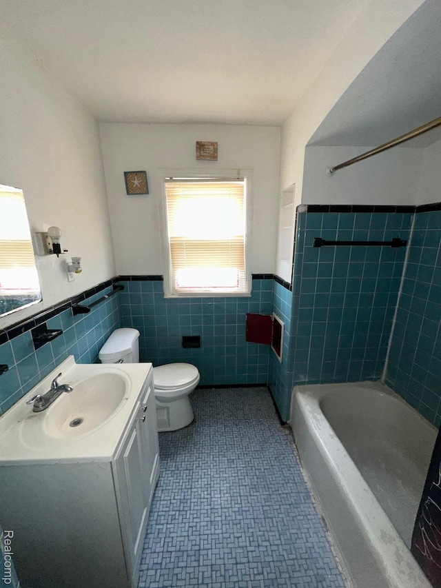 8068 Stahelin Ave, Detroit, MI 48228 - full bath featuring tile walls, wainscoting, toilet, vanity, and bathing tub / shower combination