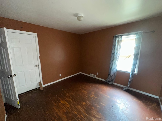 8068 Stahelin Ave, Detroit, MI 48228 - unfurnished room featuring baseboards and wood finished floors