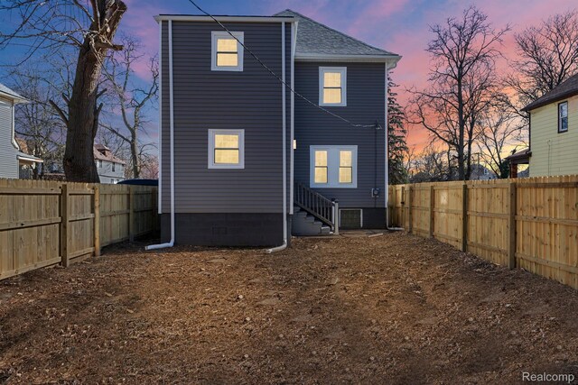 551 Englewood St, Detroit, MI 48202 - back of house with entry steps, a fenced backyard, and a shingled roof