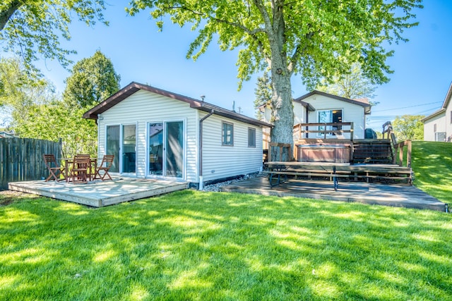 6132 W Houghton Lake Dr, Houghton Lake, MI 48629 - rear view of property featuring a wooden deck