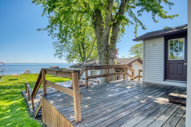 6132 W Houghton Lake Dr, Houghton Lake, MI 48629 - wooden deck with a water view and a lawn
