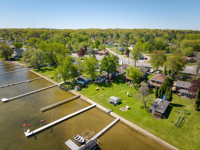 6132 W Houghton Lake Dr, Houghton Lake, MI 48629 - aerial perspective of suburban area with a large body of water