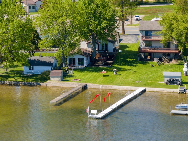 6132 W Houghton Lake Dr, Houghton Lake, MI 48629 - dock area with a water view and a lawn