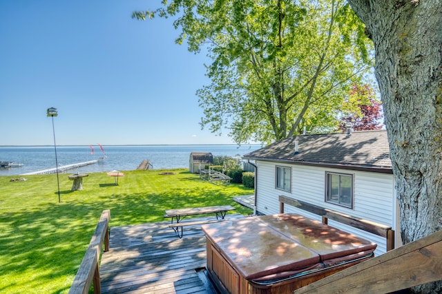 6132 W Houghton Lake Dr, Houghton Lake, MI 48629 - wooden terrace with a hot tub, a water view, and a lawn