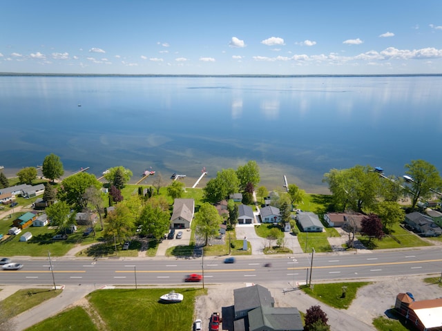6132 W Houghton Lake Dr, Houghton Lake, MI 48629 - aerial perspective of suburban area with a nearby body of water