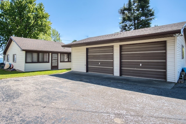 6132 W Houghton Lake Dr, Houghton Lake, MI 48629 - view of front of property featuring roof with shingles