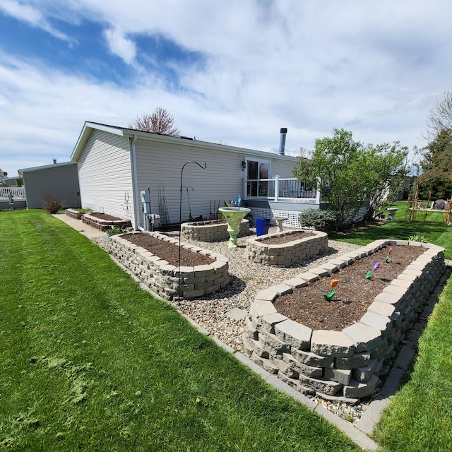 7560 Derbyboro Dr Unit 315, Caledonia, MI 49316 - back of property featuring a lawn and a deck