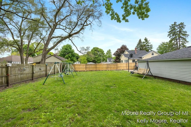 607 E Coffren St, Greenville, MI 48838 - view of yard with a playground