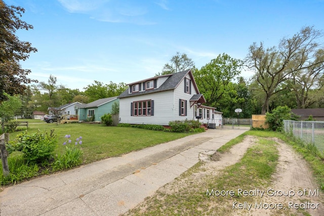 607 E Coffren St, Greenville, MI 48838 - view of front of property featuring driveway and central AC unit