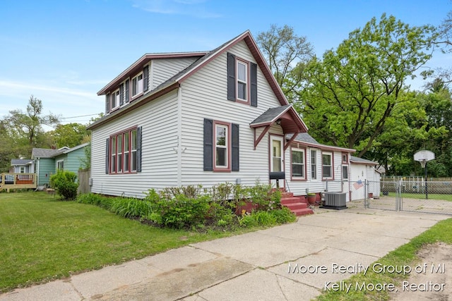 607 E Coffren St, Greenville, MI 48838 - traditional home with a gate and central AC