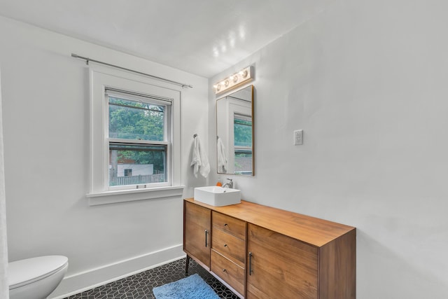 710 S 1st St, Ann Arbor, MI 48103 - bathroom featuring baseboards, vanity, and toilet