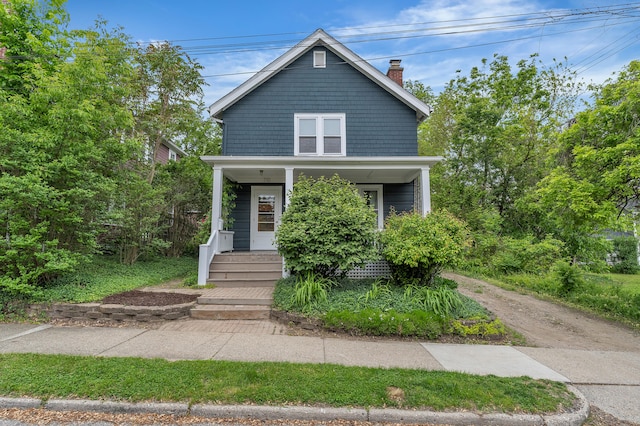 710 S 1st St, Ann Arbor, MI 48103 - american foursquare style home with a chimney and a porch