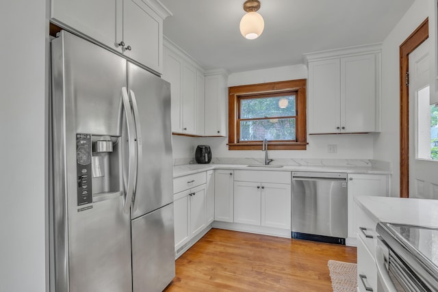 710 S 1st St, Ann Arbor, MI 48103 - kitchen with stainless steel appliances, a sink, plenty of natural light, and white cabinetry