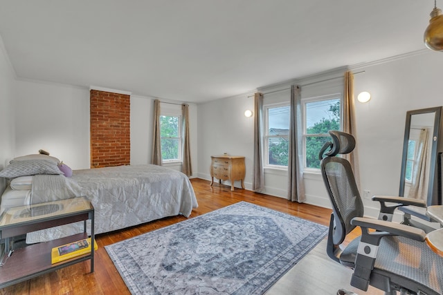 710 S 1st St, Ann Arbor, MI 48103 - bedroom featuring crown molding, wood finished floors, and baseboards