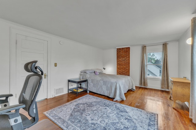 710 S 1st St, Ann Arbor, MI 48103 - bedroom with hardwood / wood-style floors, ornamental molding, and baseboards