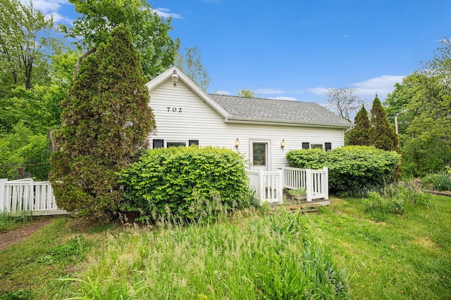 702 W Arlington St, Bangor, MI 49013 - rear view of property featuring a shingled roof