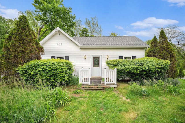 702 W Arlington St, Bangor, MI 49013 - back of house with roof with shingles