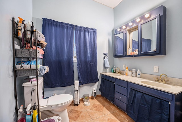 702 W Arlington St, Bangor, MI 49013 - bathroom featuring double vanity and toilet