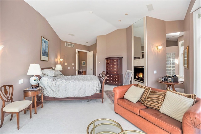 15919 Orchard Point Dr, Spring Lake, MI 49456 - bedroom with light carpet, a lit fireplace, and vaulted ceiling