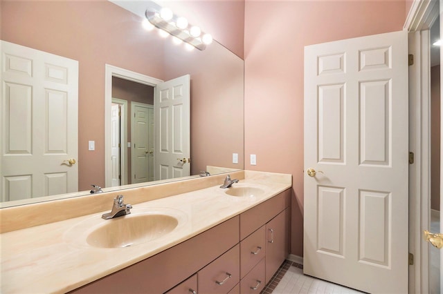 15919 Orchard Point Dr, Spring Lake, MI 49456 - bathroom with double vanity, tile patterned flooring, and baseboards