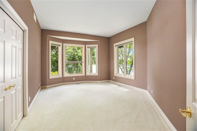 15919 Orchard Point Dr, Spring Lake, MI 49456 - empty room with light carpet and baseboards