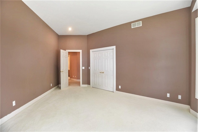 15919 Orchard Point Dr, Spring Lake, MI 49456 - unfurnished bedroom with light colored carpet, baseboards, a closet, and recessed lighting