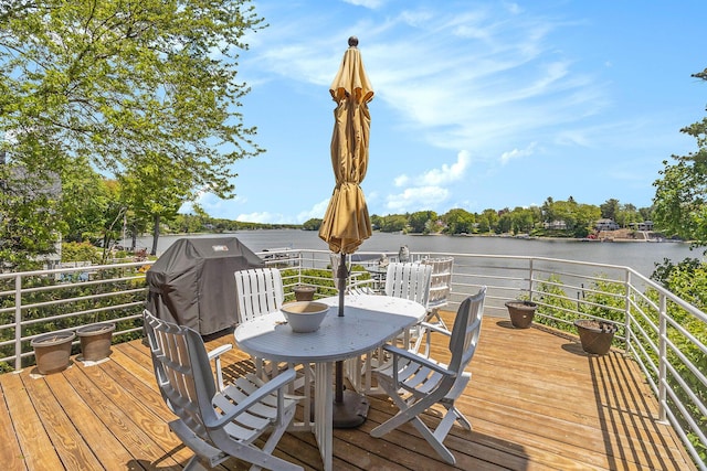 15919 Orchard Point Dr, Spring Lake, MI 49456 - wooden deck with a water view, grilling area, and outdoor dining area