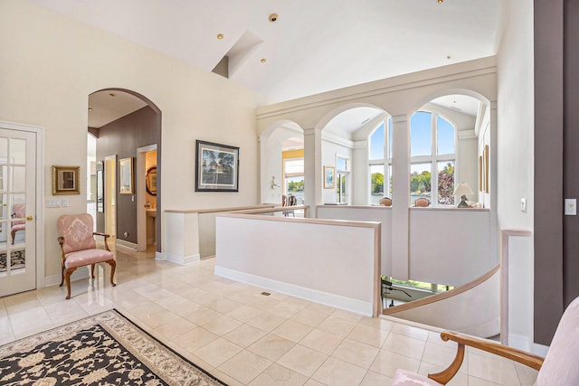 15919 Orchard Point Dr, Spring Lake, MI 49456 - foyer with light tile patterned floors, high vaulted ceiling, and arched walkways