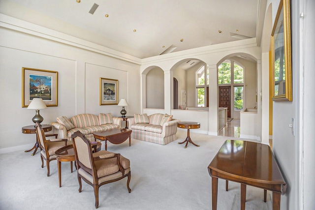 15919 Orchard Point Dr, Spring Lake, MI 49456 - living area with vaulted ceiling, light carpet, arched walkways, and baseboards
