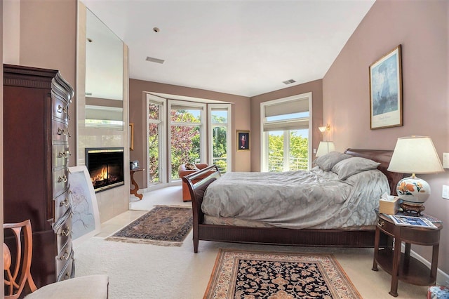 15919 Orchard Point Dr, Spring Lake, MI 49456 - bedroom featuring a fireplace and light carpet