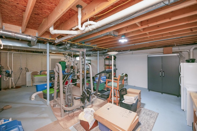 13881 Rivercrest Dr, White Pigeon, MI 49099 - unfinished basement featuring freestanding refrigerator