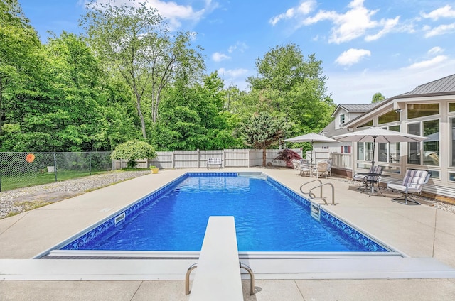 13881 Rivercrest Dr, White Pigeon, MI 49099 - view of pool with a patio, a fenced backyard, and a diving board