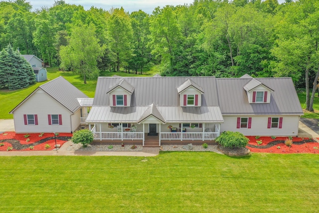 13881 Rivercrest Dr, White Pigeon, MI 49099 - new england style home with a porch, a front yard, and metal roof