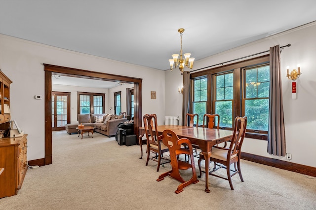2486 Whitmore Lake Rd, Ann Arbor, MI 48105 - dining room featuring light carpet, a chandelier, radiator heating unit, and baseboards