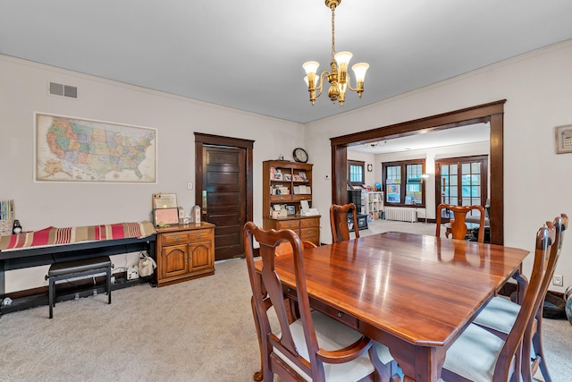 2486 Whitmore Lake Rd, Ann Arbor, MI 48105 - dining area featuring a chandelier, light colored carpet, radiator, and crown molding
