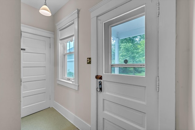 2486 Whitmore Lake Rd, Ann Arbor, MI 48105 - doorway featuring plenty of natural light, baseboards, and light colored carpet