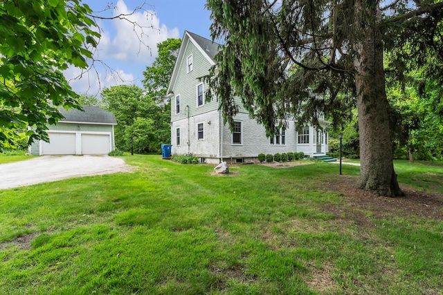 2486 Whitmore Lake Rd, Ann Arbor, MI 48105 - view of front of home featuring an outdoor structure, a front yard, and a garage