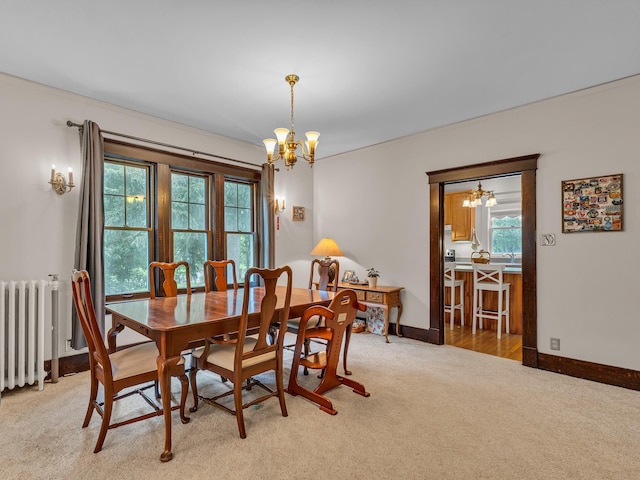 2486 Whitmore Lake Rd, Ann Arbor, MI 48105 - dining area featuring a chandelier, carpet, and healthy amount of natural light