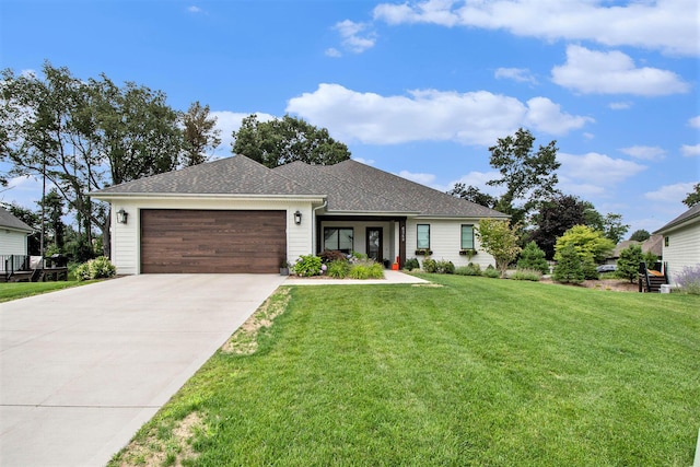 6348 Lamppost Cir SE, Grand Rapids, MI 49546 - view of front of home with an attached garage, a front yard, driveway, and roof with shingles