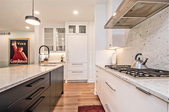 6348 Lamppost Cir SE, Grand Rapids, MI 49546 - kitchen featuring ventilation hood, a sink, white cabinets, light wood-style floors, and recessed lighting