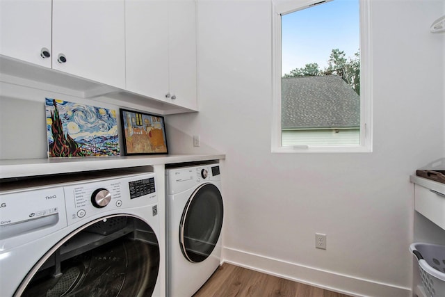 6348 Lamppost Cir SE, Grand Rapids, MI 49546 - washroom with washing machine and dryer, cabinet space, wood finished floors, and baseboards